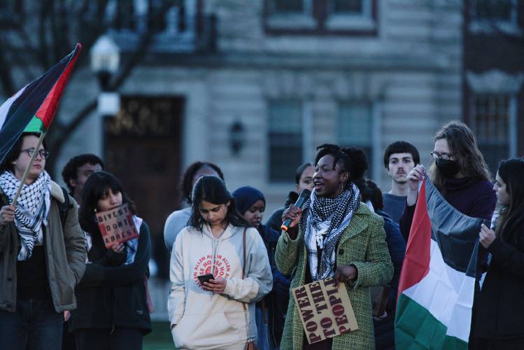Priscilla Agbeo, a graduate student in the MALS creative writing program at Dartmouth College, recites her poem Creation Song at the conclusion of a protest of the war in Gaza, on the green in Hanover, N.H., on Thursday, April 25, 2024. (Valley News - James M. Patterson) Copyright Valley News. May not be reprinted or used online without permission. Send requests to permission@vnews.com.