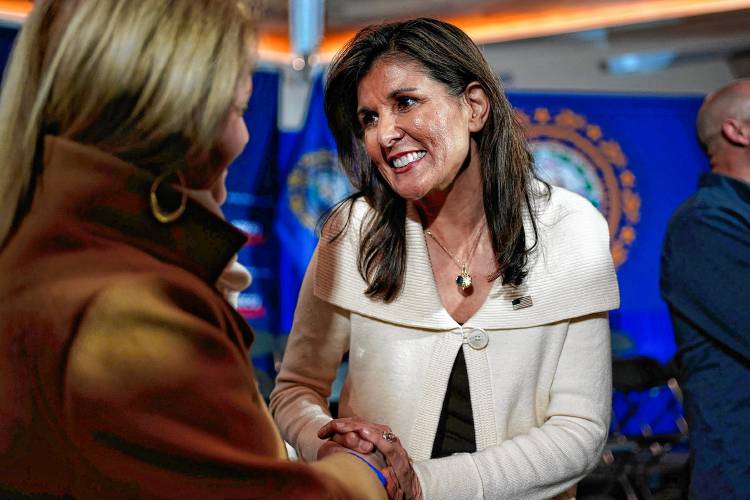 Republican presidential candidate former UN Ambassador Nikki Haley greets a voter at a town hall campaign event, Tuesday, Jan. 2, 2024, in Rye, N.H. (AP Photo/Robert F. Bukaty)