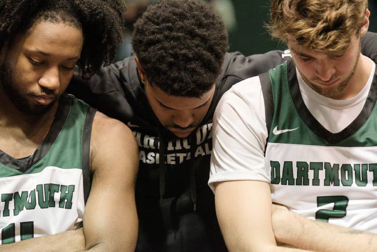 Dartmouth College men’s basketball teammates, from left, Isaiah Robinson, Robert McRae III and Cade Haskins listen to coaches during a timeout from their game with Westfield State at Leede Arena in Hanover, N.H., on Wednesday, Nov. 16, 2023. McRae is a team captain and Haskins has made statements regarding their effort to join the SEIU Local 560. (Valley News - James M. Patterson) Copyright Valley News. May not be reprinted or used online without permission. Send requests to permission@vnews.com.