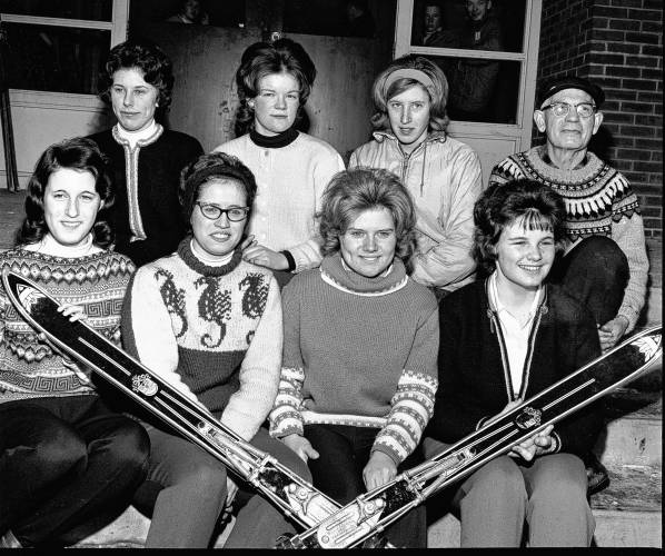 Coach Erling Heistad, upper right, with the Lebanon girls alpine ski team on Feb. 18, 1963. In the front from left are Nancy Carter, Barbara Carter, Sue Ames and June Blake. In the back from left are Debby Douglas, Connie Berry and Sally Couser. (Valley News - Don Fillion) Copyright Valley News. May not be reprinted or used online without permission. Send requests to permission@vnews.com.